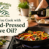 Cooking with cold-pressed olive oil in a skillet using Old Metairie Olive Oils