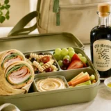 Back-to-school lunch ideas in Metairie with olive oil, balsamic vinegar, wraps, pasta salad and fresh fruit